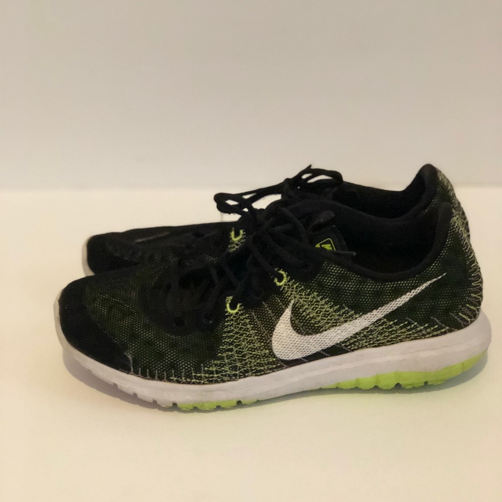 Black and green Nike shoes